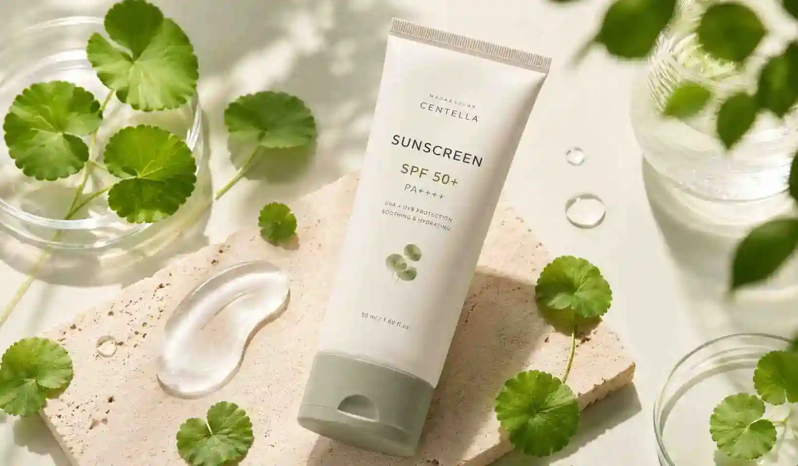 Centella sunscreen products arranged in a soft minimal skincare flat lay for sensitive skin